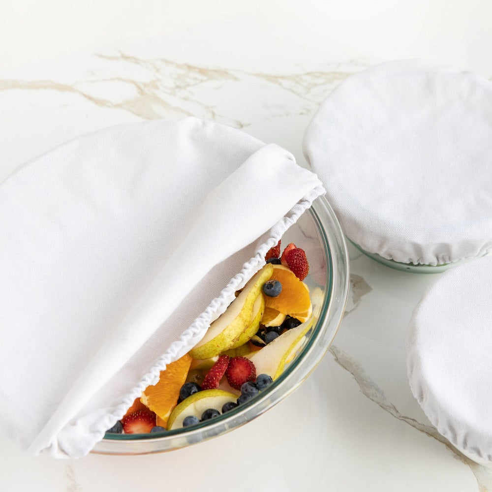 4MyEarth Food Cover set in Stone shown on bowls with fruit salad