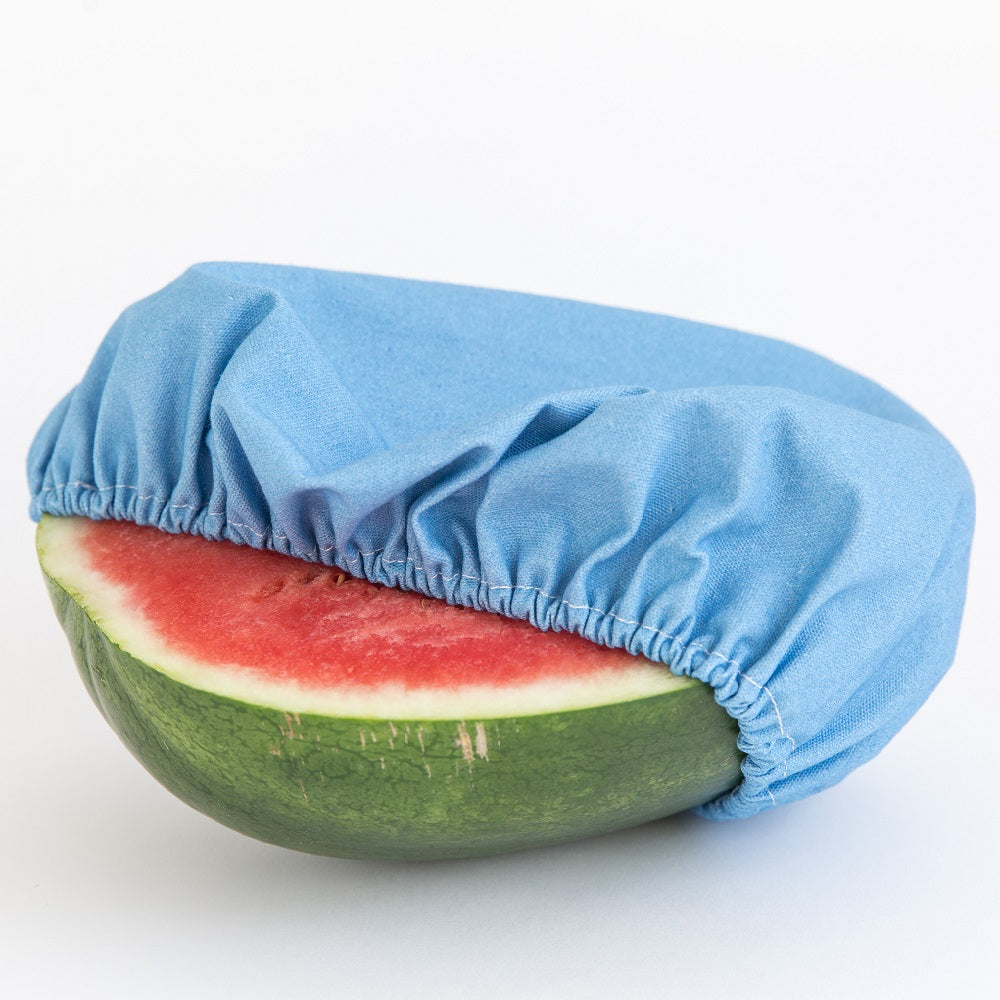 4MyEarth Food Cover XL in plain Denim on a cut Watermelon