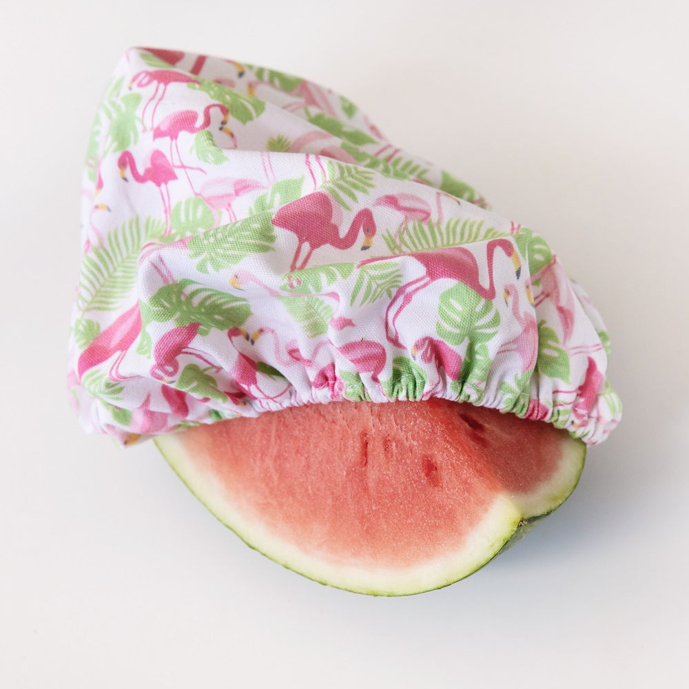 4MyEarth Food Cover XL covering a cut watermelon in Flamingoes print